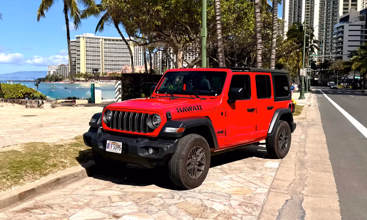 Red hardtop Jeep Wrangler