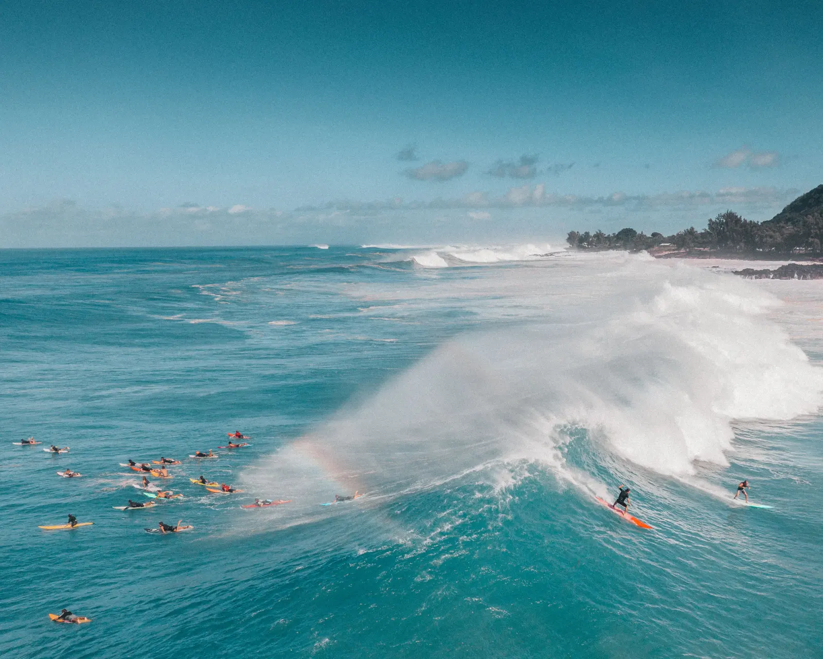 Waimea Bay framed by the green North Shore mountains